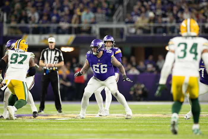 Dalton Risner (66) prepares to block Kenny Clark (97)