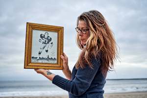 Linda Lee Stonebreaker holding a portrait of her father