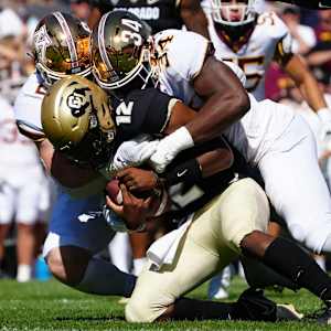 Boye Mafe with a sack against Colorado.