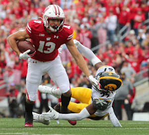Wisconsin wide receiver Chimere Dike breaks a tackle against Iowa.