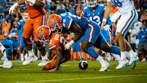 Florida Gators DE Tyreak Sapp forces a fumble while tackling RB Demarkcus Bowman.