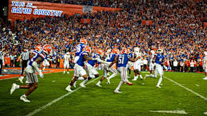 Amari Burney (2) and teammates celebrate Burney's walk-off interception in Florida's 2022 victory over Utah.