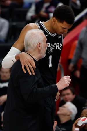 Jan 10, 2024; Detroit, Michigan, USA; San Antonio Spurs head coach Gregg Popovich talks to center Victor Wembanyama (1) in the second half against the Detroit Pistons at Little Caesars Arena.