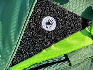 A Velcro patch for storing a glove on the Sun Mountain Eco-Lite stand bag.