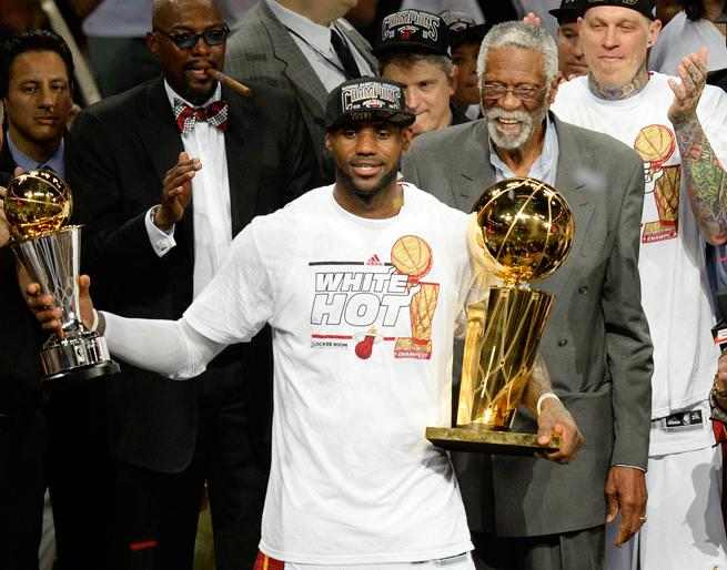 How does the back-to-back championships by LeBron James and the Heat compare to the Dolphins' consecutive titles in 1972 and '73?