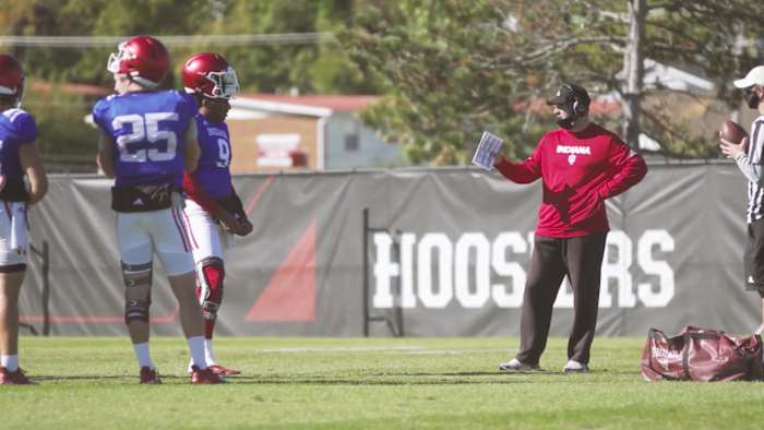 Indiana offensive coordinator Nick Sheridan has a conversation with quarterback Michael Penix Jr. (9) during a recent practice. (Photo courtesy of IU Athletics)