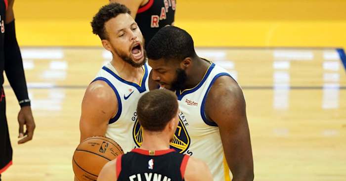 Jan 10, 2021; San Francisco, California, USA; Golden State Warriors guard Stephen Curry (30) reacts after a basket by forward Eric Paschall (7) during the third quarter against the Toronto Raptors at Chase Center. Mandatory Credit: Darren Yamashita-USA TODAY Sports