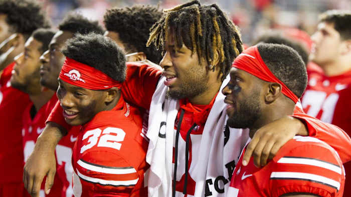 82. Jakailin Johnson, Jaylen Johnson and Marcus Williamson