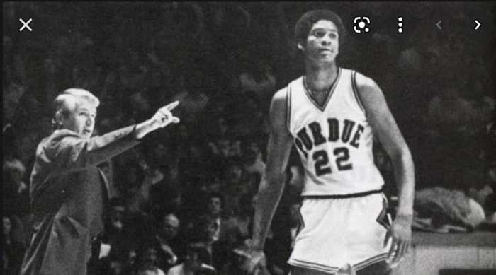 Purdue coach Lee Rose (left) gives instructions to center Joe Barry Carroll during the 1980 season.