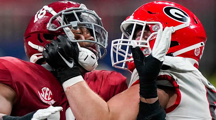 FILE - Georgia offensive lineman Warren Ericson (50) and Alabama wide receiver Slade Bolden (18) play during the second half of the Southeastern Conference championship NCAA college football game, Saturday, Dec. 4, 2021, in Atlanta. Those Georgia Bulldogs aren't the only ones having a devil of a time beating fellow Southeastern Conference powerhouse Alabama. They're just the only one that gets another shot in the biggest game of them all.