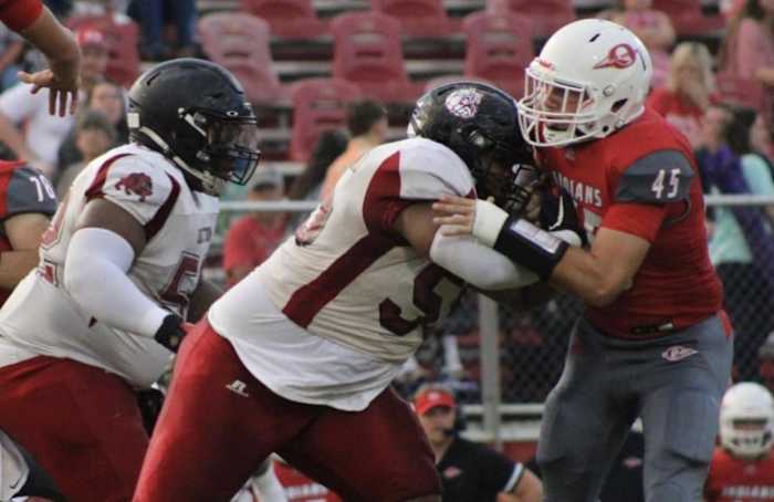Class of 2023 lineman RyQueze McElderry makes a block for Anniston High School.