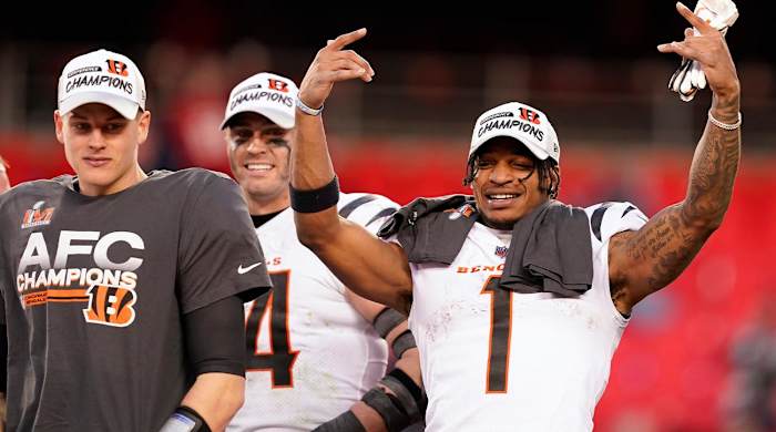 Cincinnati Bengals quarterback Joe Burrow, left, and wide receiver Ja'Marr Chase (1) celebrate after the AFC championship NFL football game against the Kansas City Chiefs, Sunday, Jan. 30, 2022, in Kansas City, Mo. The Bengals won 27-24 in overtime.