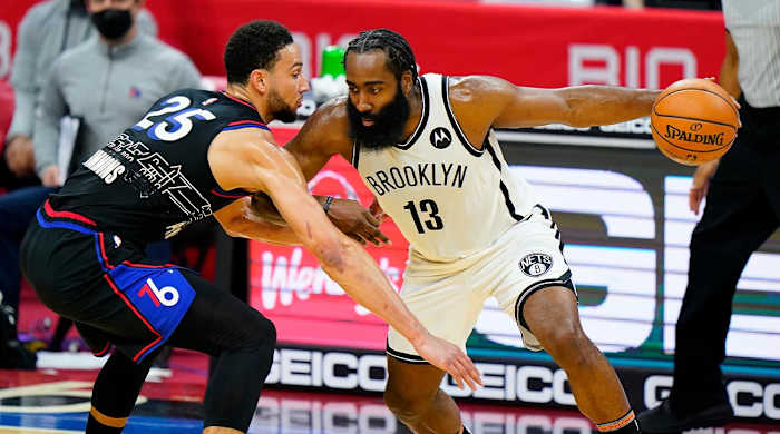 FILE - Brooklyn Nets' James Harden (13) tries to drive past Philadelphia 76ers' Ben Simmons (25) during the second half of an NBA basketball game, Saturday, Feb. 6, 2021, in Philadelphia. The Philadelphia 76ers have traded Ben Simmons to the Brooklyn Nets for James Harden as part of a multiplayer deal. The trade was confirmed by multiple people who spoke to The Associated Press Thursday, Feb. 10, 2022, on condition of anonymity because the trade had not been announced.