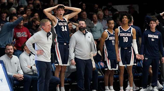 Gonzaga coach Mark Few, standing at left, reacts to a call with Chet Holmgren (34), Nolan Hickman (11) and Hunter Sallis (10) during the second half of the team's NCAA college basketball game against Saint Mary's in Moraga, Calif., Saturday, Feb. 26, 2022.