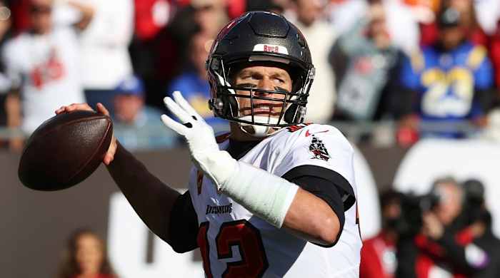 FILE - Tampa Bay Buccaneers quarterback Tom Brady (12) throws a pass against the Los Angeles Rams during the first half of an NFL divisional round playoff football game Jan. 23, 2022, in Tampa, Fla. Brady’s retirement lasted 40 days. He said Sunday, March 13, 2022, he is returning to the Buccaneers for his 23rd season in the NFL.