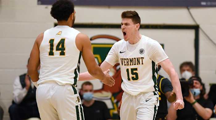 Vermont’s Finn Sullivan (15) reacts toward teammate Isaiah Powell (14)in the first half of an NCAA college basketball game for the America East Conference tournament championship, Saturday, March 12, 2022, in Burlington, Vt.