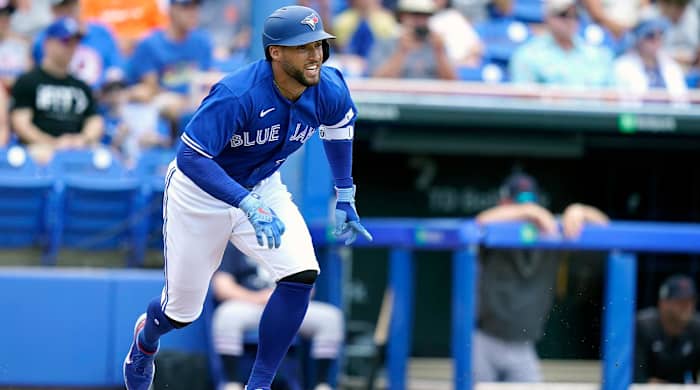 Toronto Blue Jays’ George Springer runs after hitting a single during the first inning of a spring training baseball game against the Detroit Tigers, Thursday, March 31, 2022, in Dunedin, Fla.
