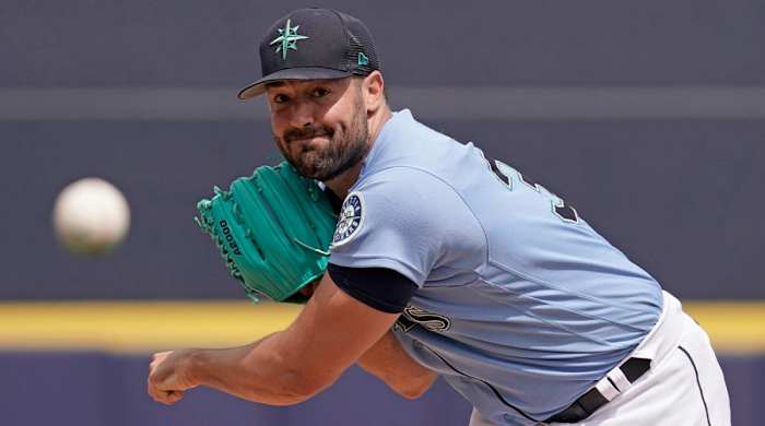 Seattle Mariners starting pitcher Robbie Ray throws during the first inning of a spring training baseball game against the Texas Rangers Monday, March 28, 2022, in Peoria, Ariz.