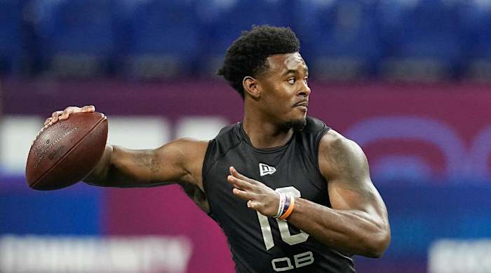 FILE - Liberty quarterback Malik Willis runs a drill during the NFL football scouting combine, Thursday, March 3, 2022, in Indianapolis. Franchises still searching for a prized quarterback won’t find much star power in this year’s crop of college QBs. Still, there’s potential upgrades to be had in the likes of Temple’s Malik Willis and Pitt’s Kenny Pickett.