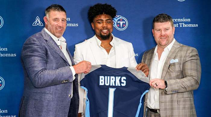 Tennessee Titans first round draft pick wide receiver Treylon Burks, center, holds up his jersey with head coach Mike Wrabel, left, and general manager Jon Robinson, right, during an introductory press conference at Saint Thomas Sports Park in Nashville, Tenn., Friday, April 29, 2022.