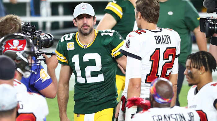 Oct 18, 2020; Tampa, Florida, USA; Tampa Bay Buccaneers quarterback Tom Brady (right) greets Green Bay Packers quarterback Aaron Rodgers (left) after a NFL game at Raymond James Stadium.