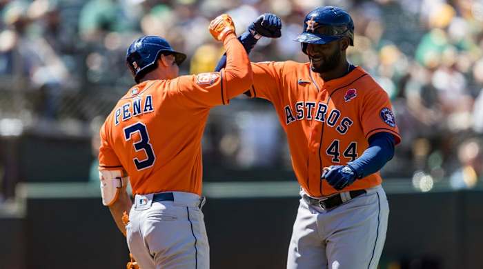 Houston Astros’ Yordan Alvarez (44) celebrates with Jeremy Pena (3) after Alvarez hit a solo home run against the Oakland Athletics during the eighth inning of a baseball game in Oakland, Calif., Monday, May 30, 2022.