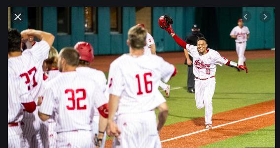 Collin Hopkins' teammates prepare tomob him after his walk-off home run last Friday night against Illinois. (Photo courtesy of IU Athletics.)