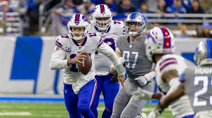 Nov 24, 2022; Detroit, Michigan, USA; Buffalo Bills quarterback Josh Allen (17) runs with the ball against the Detroit Lions during the first quarter at Ford Field.