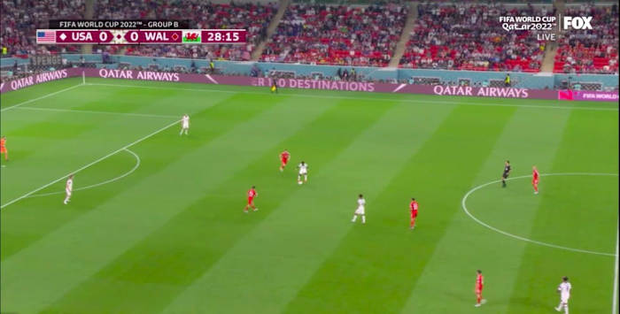 USMNT midfielder Yunus Musah picks up the ball deep in midfield vs. Wales.