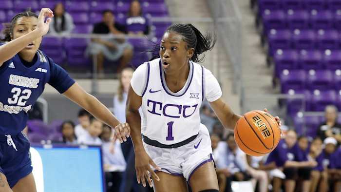 TCU's Tomi Taiwo drives to the basket against George Washington.