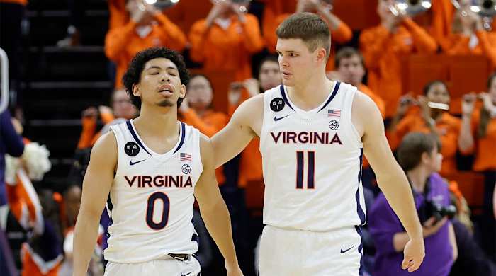 Dec 6, 2022; Charlottesville, Virginia, USA; Virginia Cavaliers guard Kihei Clark (0) reacts with Cavaliers guard Isaac McKneely (11) after their game against the James Madison Dukes at John Paul Jones Arena.