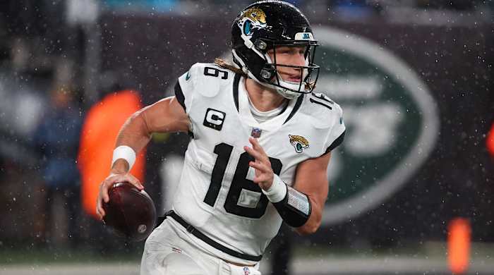 Dec 22, 2022; East Rutherford, New Jersey, USA; Jacksonville Jaguars quarterback Trevor Lawrence (16) runs with the ball against the New York Jets during the first half at MetLife Stadium.