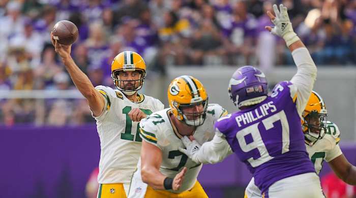 Sep 11, 2022; Minneapolis, Minnesota, USA; Green Bay Packers quarterback Aaron Rodgers (12) passes against the Minnesota Vikings in the third quarter at U.S. Bank Stadium.