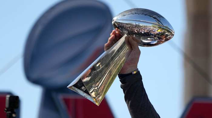 Feb 16, 2022; Los Angeles, CA, USA; Los Angeles Rams tackle Andrew Whitworth holds the Vince Lombardi trophy during the Super Bowl LVI championship rally at the Los Angeles Memorial Coliseum.