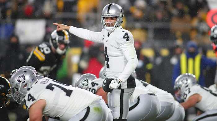 Las Vegas Raiders Derek Carr (4) points to Pittsburgh Steelers safety Minkah Fitzpatrick during the first half at Acrisure Stadium in Pittsburgh, PA on December 24, 2022.