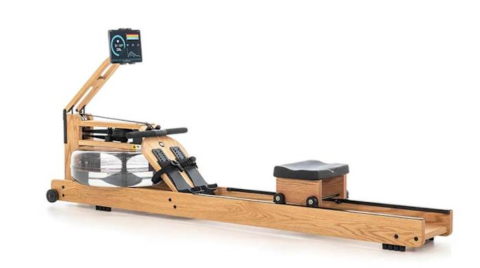 The WaterRower machine in a light wood stain