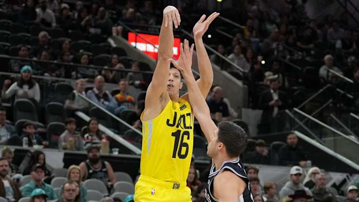 Utah Jazz forward Simone Fontecchio (16) shoots over San Antonio Spurs forward Doug McDermott (17) in the first half at the AT&T Center.
