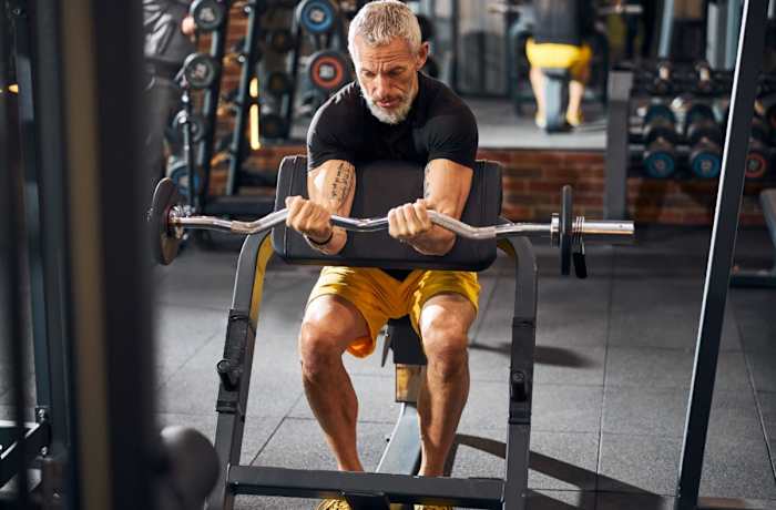 EZ Curl Bar Bicep Curl _ Source iStock