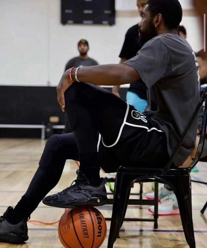 Kyrie Irving looks on during a basketball game.