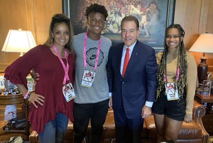 Caleb Downs and his family with Nick Saban.