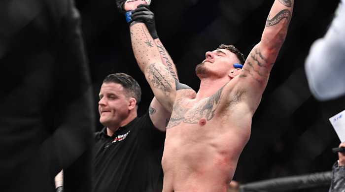 Mar 19, 2022; London, UK; Tom Aspinall (blue gloves) defeats Alexander Volkov (red gloves) during UFC Fight Night at O2 Arena.