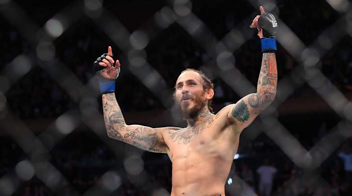 Nov 6, 2021; New York, NY, USA; Marlon Vera (blue gloves) celebrates after defeating Frankie Edgar (red gloves) during UFC 268 at Madison Square Garden.