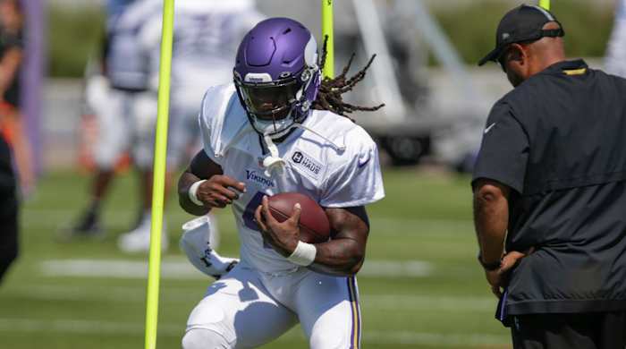 Minnesota Vikings running back Dalvin Cook runs during drills at the NFL football team’s practice facility in Eagan, Minn., Monday, Aug. 1, 2022.