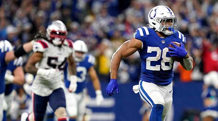 Colts running back Jonathan Taylor breaks away from the Patriots defense on his fourth-quarter touchdown run.
