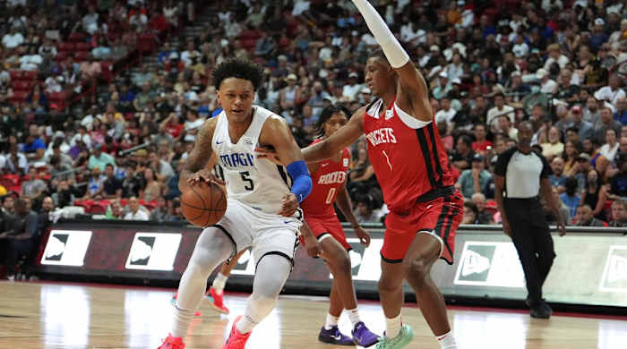 Jul 7, 2022; Las Vegas, NV, USA; Orlando Magic forward Paolo Banchero (5) dribbles against Houston Rockets forward Jabari Smith II (1) during an NBA Summer League game at T&M.