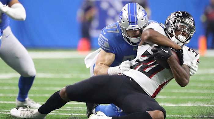 Aug 12, Detroit, MI, USA; Detroit Lions defensive end Aidan Hutchinson tackles Atlanta Falcons running back Qadree Ollison (30) during the first half of a preseason game Aug. 12, 2022 at Ford Field.