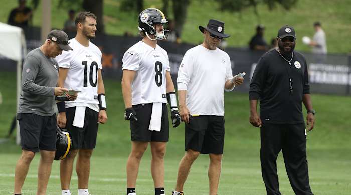 Jul 27, 2022; Latrobe, PA, USA; Pittsburgh Steelers quarterbacks coach Mike Sullivan (left) and quarterbacks Mitch Trubisky (10) and Kenny Pickett (8) and offensive coordinator Matt Canada (in white) and head coach Mike Tomlin (right) participate in training camp at Chuck Noll Field.