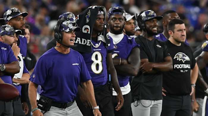 Aug 11, 2022; Baltimore, Maryland, USA; Baltimore Ravens head coach John Harbaugh reacts while standing with quarterback Lamar Jackson (8) during the game against the Tennessee Titans at M&T Bank Stadium.