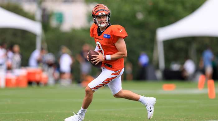 Cincinnati Bengal quarterback Joe Burrow looks for a receiver during NFL football training camp in Cincinnati, Monday, Aug. 15, 2022.