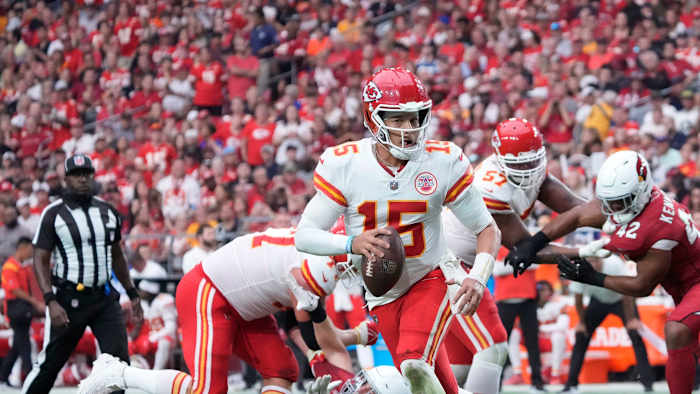 Sep 11, 2022; Glendale, Arizona, United States; Kansas City Chiefs quarterback Patrick Mahomes (15) scrambles out of the pocket against the Arizona Cardinals during the third quarter at State Farm Stadium.